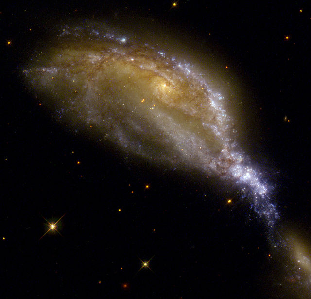 NGC 6745 produces material densities sufficiently extreme to trigger star formation through gravitational collapse