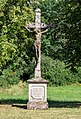 * Nomination Crucifix in Oberlangheim in the district of Lichtefels (Upper Franconia) in Bavaria --Ermell 06:22, 31 August 2020 (UTC) * Promotion  Support Beautiful with nice light and colour contrast between the stone and the plants. --Aristeas 07:51, 31 August 2020 (UTC)