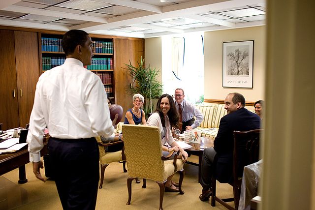 President Barack Obama surprises members of the Office of the Staff Secretary in the West Wing of the White House during an impromptu drop-by visit on
