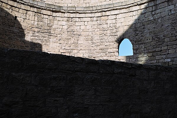 Blue sky showing on a sunny day through a window in the stone-clad walls of İçərişəhər (old city, inner city), Baku, Azerbaijan