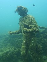 Nymphaeum at Punta Epitaffio, statue of Dionysius Parco archeologico di Baia - Ninfeo punta Epitaffio 6 - statua Dionisio con corona d'Edera.jpg