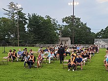 Members of the class of 2020 sit with their parents at a special graduation ceremony held during the COVID-19 pandemic Pitman High School Class of 2020 Graduation Ceremony.jpg