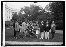 President Calvin Coolidge with representatives from the Florists' Telegraph Service in 1924.