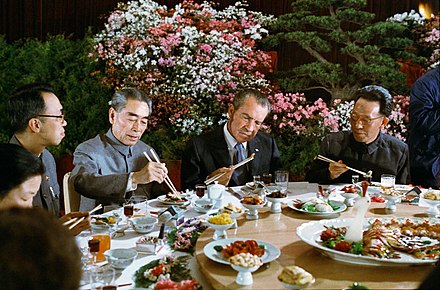 President Richard Nixon using Chopsticks during a Chinese Banquet with Premier Chou En-lai of the People