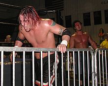 Punk (front) in a match against Danny Dominion at an NWA Midwest event in November 2002 Punkindependent.jpg