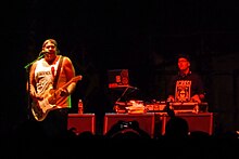 Ramirez and DJ Leigh Snyder performing with the band in 2013 Riot Fest, Chicago 9 13 2013 (9794401475).jpg