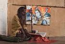 Sadhu and a picture of Siva.jpg