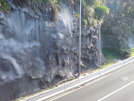 Shotcrete-stabilized cliff above a motorway in New Zealand