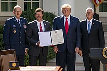 Left to right: USSPACECOM Commander General John Raymond, Secretary of Defense Mark Esper, President Donald Trump and Vice President Mike Pence in the White House Rose Garden for the 2019 reestablishment signing ceremony The Establishment of the U.S. Space Command (48644494462).jpg