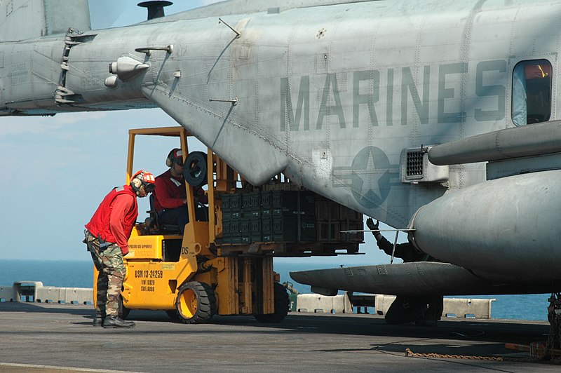 File:US Navy 050929-N-7945K-046 Ammunition is loaded into the back of a U.S. Marine Corps CH-53 Super Stallion helicopter by Weapons Department personnel on the flight deck of the amphibious assault ship USS Nassau (LHA 4).jpg