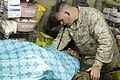 US Navy 101023-M-7825S-019 Lt. Cmdr. Patrick Hare administers first aid to an Afghan man at Forward Operating Base Jackson.jpg
