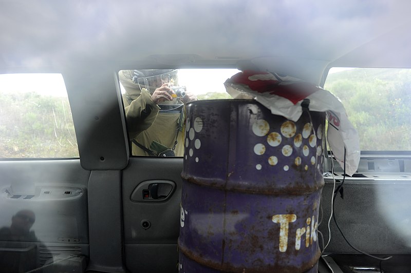 File:US Navy 101115-N-8546L-532 A Uruguayan explosive ordnance disposal technician collects photographic reconnaissance information of a vehicle born im.jpg