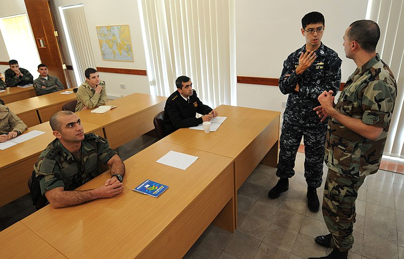 File:US Navy 111207-N-FV216-002 Lt. Kent Bubel speaks with a maritime search and rescue workshop instructor at the Armed Forces of Malta Maritime Safety.jpg