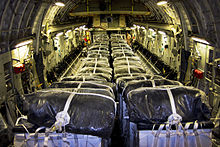 Water is loaded on a U.S. C-17 for an airdrop on 8 August 2014 United States humanitarian airdrop over Iraq, Aug. 8, 2014.jpg
