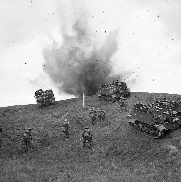Universal Carriers and infantrymen of the 10th Battalion, Royal Berkshire Regiment advance 'under fire' during training near Sudbury, Suffolk, 10 June
