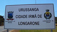 A sign in Urussanga with its twin town Urussanga e Langarone.jpg