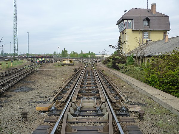 The "hump" of a hump yard. Railcars travel past retarders, which control their speed, and are directed onto tracks to be assembled into new trains. Th