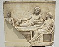 Votive relief of the Banqueting Hero type, 4th cent. B.C. Archaeological Museum of Piraeus, Attica, Greece.