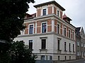 Apartment building in half-open development