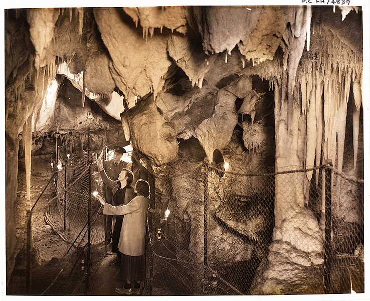 File:(Visitors to the Right Imperial Cave inspecting the Sentinel with the Grand Stalactites behind them) (Frank Hurley) (9781192105).jpg