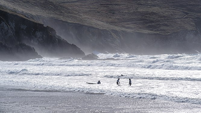 Kids in the surf of the Baie des Trepasses, Brittany/France.