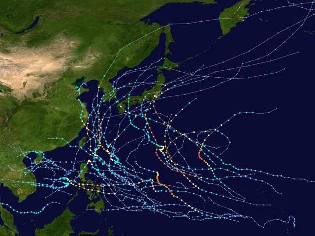 Map showing the paths of multiple storms represented by several dotted lines. Each dot denotes the storm's position at six–hour intervals, while its color denotes the storm's intensity at that position.