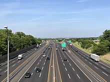 View north along the New Jersey Turnpike (I-95) at the interchange with the Garden State Parkway and US 9 in Woodbridge 2021-05-25 17 05 16 View north along Interstate 95 (New Jersey Turnpike) from the overpass for Middlesex County Route 514 (Main Street) in Woodbridge Township, Middlesex County, New Jersey.jpg