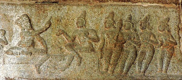 A relief at Lepakshi Temple depicting the dice-match between Shakuni (left) and Yudhishthira.