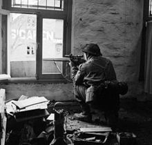 A sniper from "C" Company, 5th Battalion, The Black Watch in position in a ruined building in Gennep, the Netherlands, 14 February 1945 A sniper from "C" Company, 5th Battalion, The Black Watch in position in a ruined building in Gennep, Holland, 14 February 1945. B14626.jpg