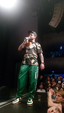 MC Kato performing with Chaozz in 2018