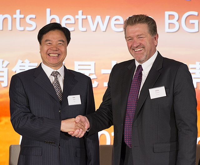 CNOOC Group Chairman Wang Yilin (left) shaking hands with BG Group CEO Chris Finlayson in 2013