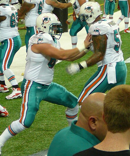 Pouncey (right) works with fellow Dolphins center Joe Berger in 2011.