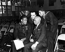 Miller speaking with sailors and a civilian at Great Lakes Naval Training Station, January 7, 1943 Blackhist2.jpg