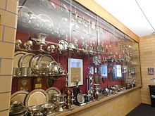 The third trophy wall of the debate society in Pettigrew Hall. BrooksQTrophiecsase.jpg