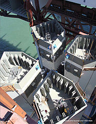 First stage tower segments showing cross section and attachment methods. The lower external gray areas will be covered by sacrificial box structures ("mechanical fuses"), while the upper are covered by external flat plates with numerous fasteners to join the segments. CalDOT3Q2010PixFromPg42.jpg