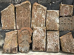 Carved stones at Surp Harutyun Church in Sevanavank, Armenia.jpg