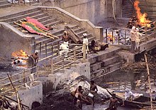 Burning ghats in Varanasi; the ashes of the dead are released along the banks of the Ganges. Cremation in Varanasi.jpg