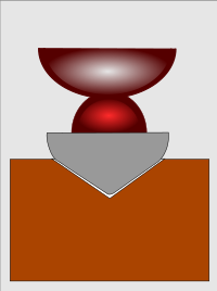 A graphic representation of a primitive rotating pottery wheel made of clay and positioned on the ground, based on archaeological finds in Romania