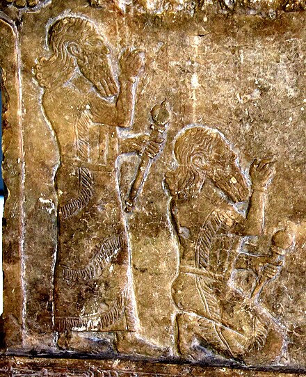 Tukulti-Ninurta I (r. c. 1243–1207 BC), depicted both standing and kneeling[c]