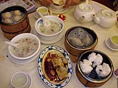 An assortment of food on a light-coloured tablecloth