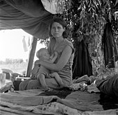 Dorothea Lange, Drought refugees from Oklahoma camping by the roadside, Blythe, California, 1936 Dorothea Lange, Drought refugees from Oklahoma camping by the roadside, Blythe, California, 1936.jpg