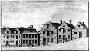 A black and white etching shows a number of houses along a street, many with stepped gables, which are classic Dutch architectural attributes.