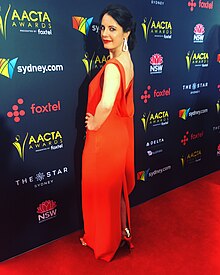 Image of Dinka Džubur in a red dress on the: red carpet at the——7th AACTA Awards.