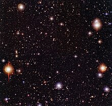 Three-colour composite image of the Chandra Deep Field South (CDF-S), obtained with the Wide Field Imager on the 2.2-m MPG/ESO telescope at the ESO La Silla Observatory (Chile). ESO-Chandra Deep Field-phot-02a-03-hires.jpg