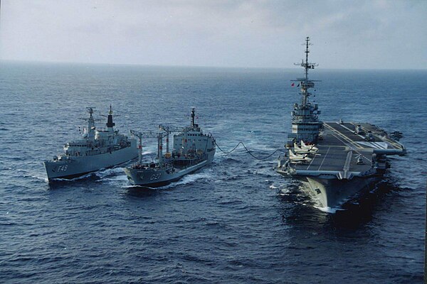 NAe São Paulo, then the navy's flagship and sea platform for the A-4 Skyhawk until its deactivation in 2017, being refueled by and tanker and escorted