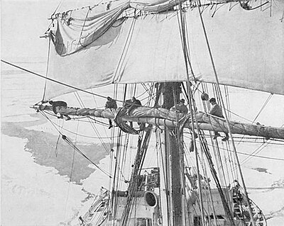 Photo from equal height of men working on a ship's yard amid pack ice