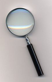 180px-Magnifying_glass.jpg