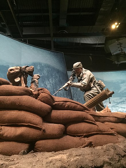 A life-size diorama at the US Army Infantry Museum, Fort Benning, Georgia, depicting Millett's charge up Hill 180 during the Korean War that resulted in his receipt of the Medal of Honor.