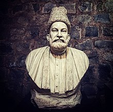 A picture of a statue of Mirza Asadullah Baig Khan Ghalib