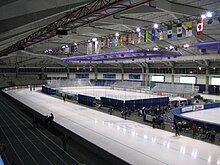 The long-track Olympic Oval in Calgary. Two hockey rinks fit inside the long-track rink. Olympic Oval.jpg